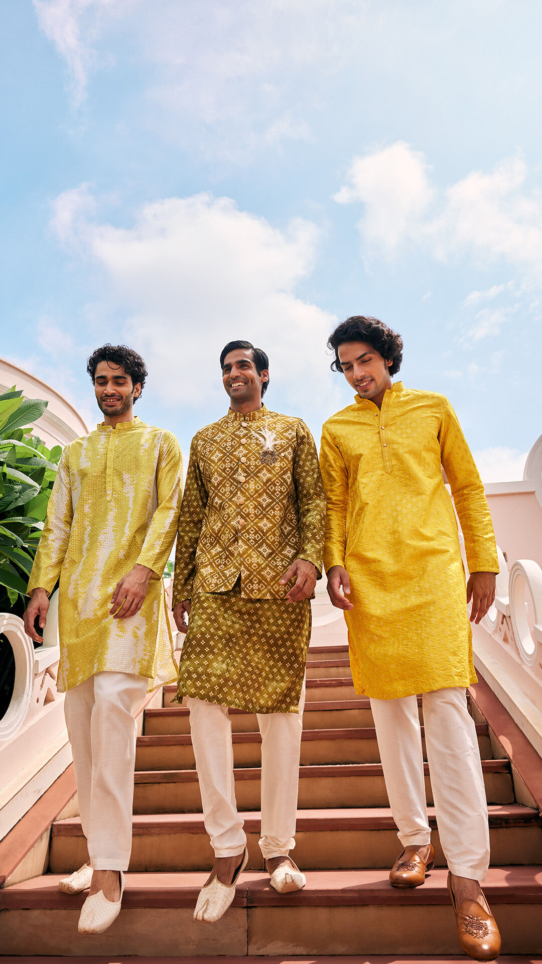 Three friends dressed in traditional outfits heading to a Haldi ceremony
